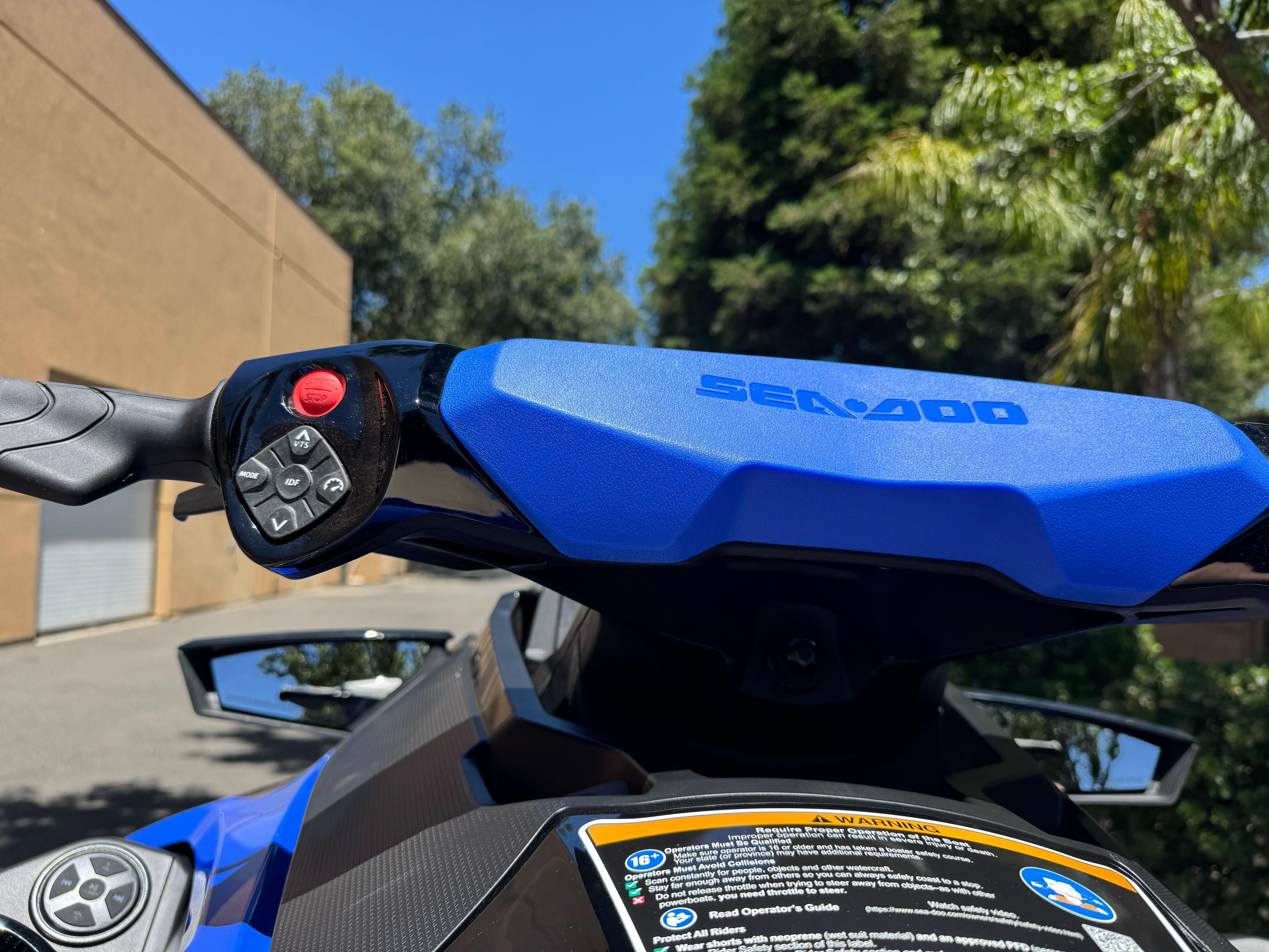 2025 Sea-Doo Wake Pro 230 handlebars and controls, outdoor setting.