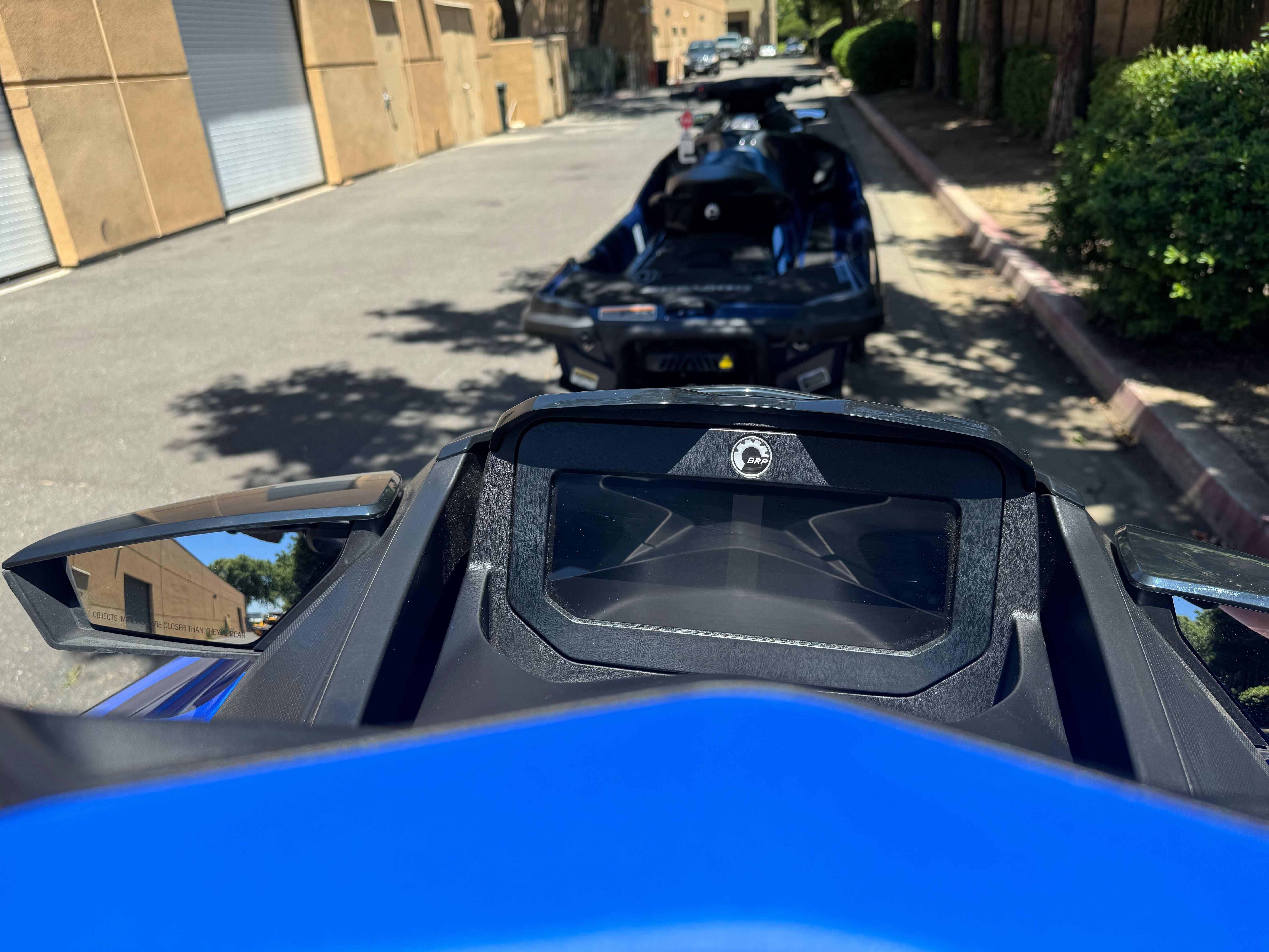 2025 Sea-Doo Wake Pro 230 dashboard view, parked on a sunny street.