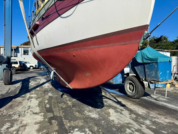 Bristol Channel Cutter 28 sailboat, 1982 model, on dry dock for maintenance.
