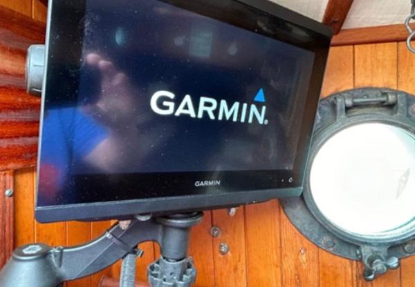 Garmin display on 1982 Bristol Channel Cutter 28, wooden interior, nautical setting.