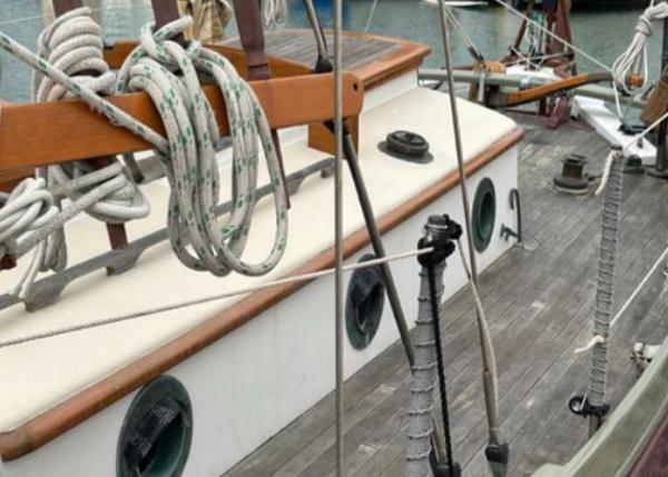 1982 Bristol Channel Cutter 28 sailboat deck with ropes and wooden details.