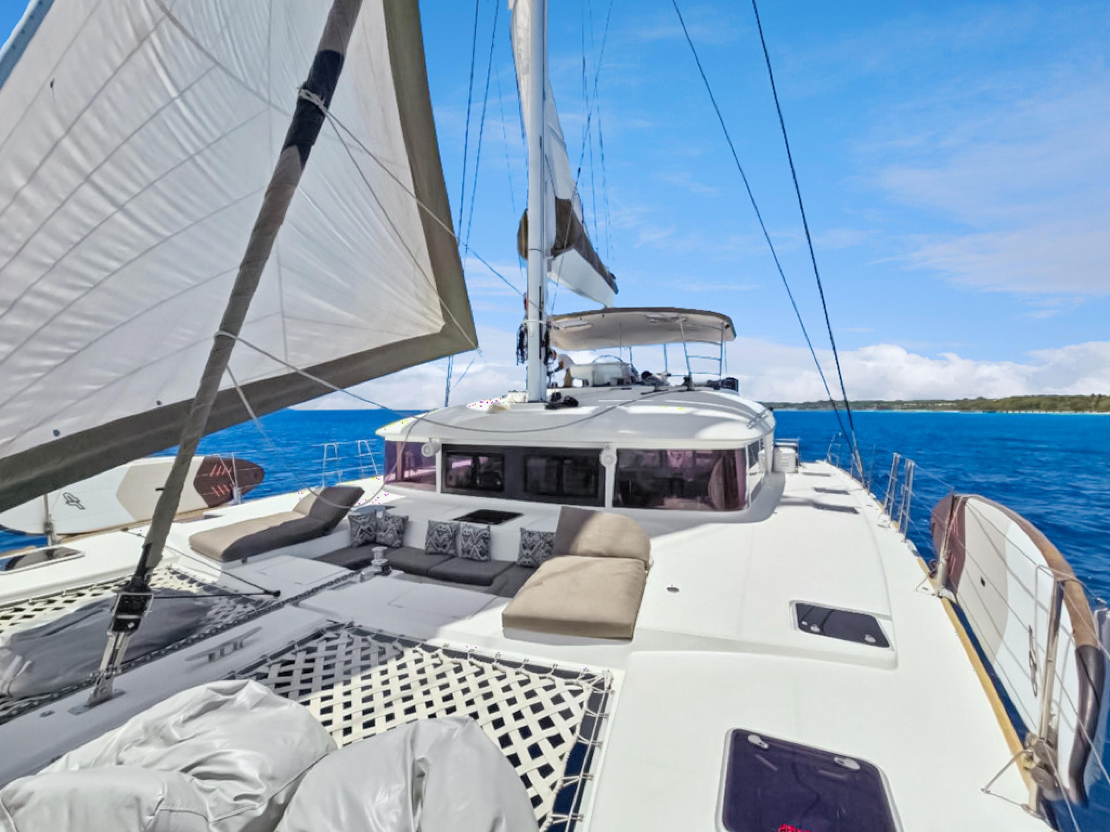 Lagoon-560 S2 2015-Cool Runnings IV SC-US-2015 Lagoon 560 S2 yacht sailing on clear blue waters under a sunny sky.-9782915 | Thumbnail