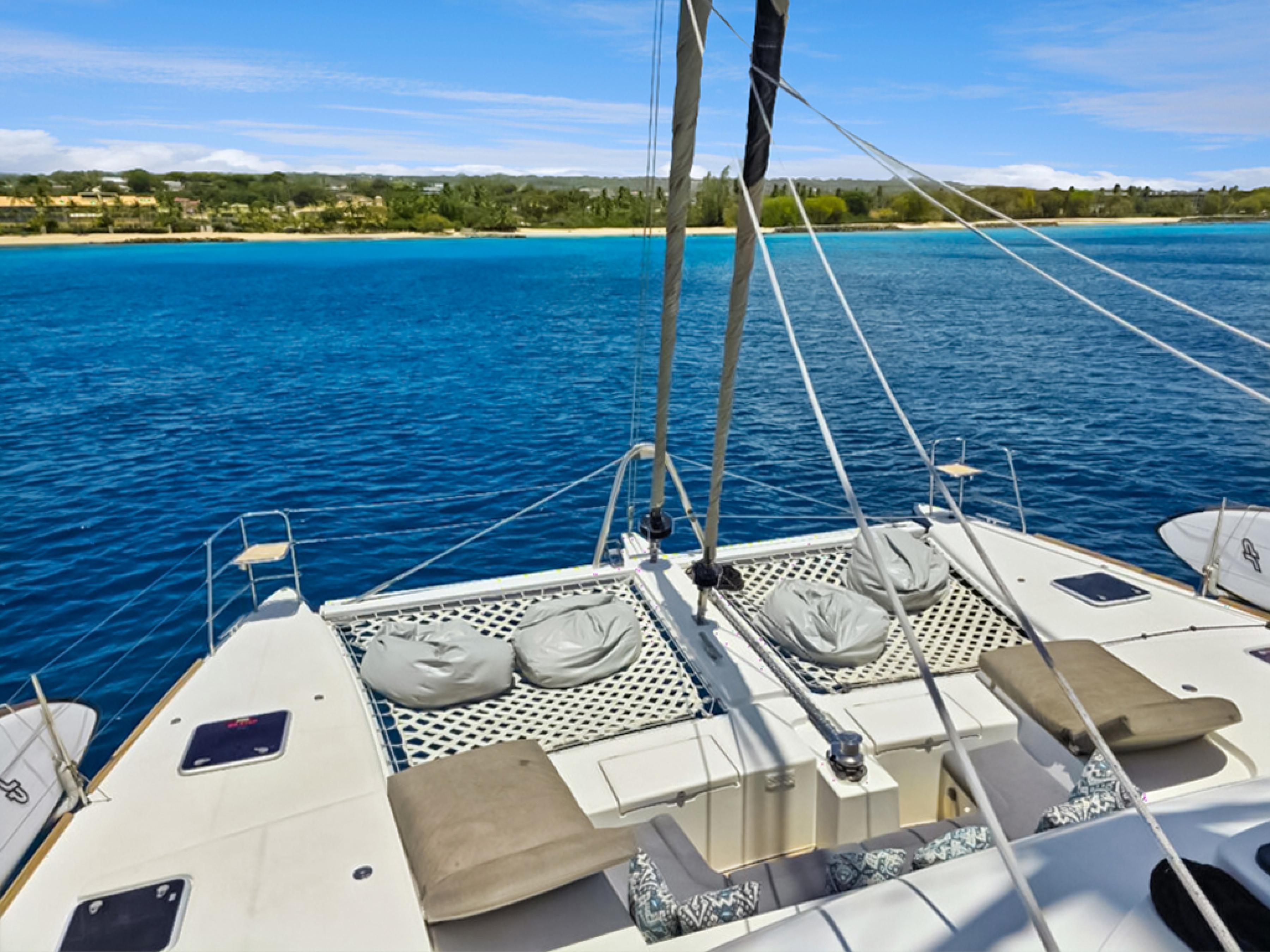 Lagoon-560 S2 2015-Cool Runnings IV SC-US-Lagoon 560 S2 yacht deck with bean bags, overlooking serene blue waters, 2015 model.-9782915 | Thumbnail