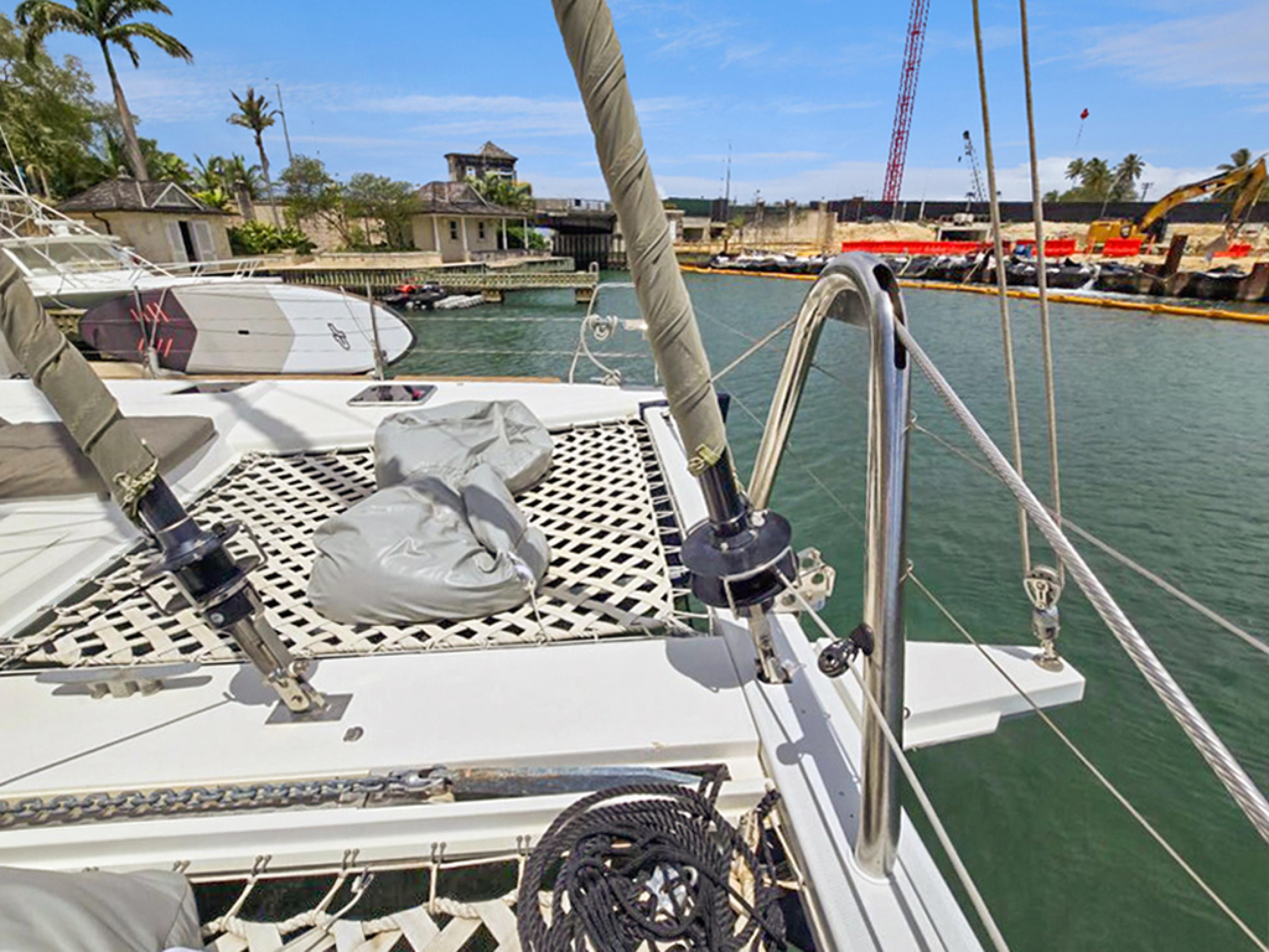 Lagoon-560 S2 2015-Cool Runnings IV SC-US-Lagoon 560 S2 yacht docked in a marina, showcasing deck and rigging, 2015 model.-9782915 | Thumbnail