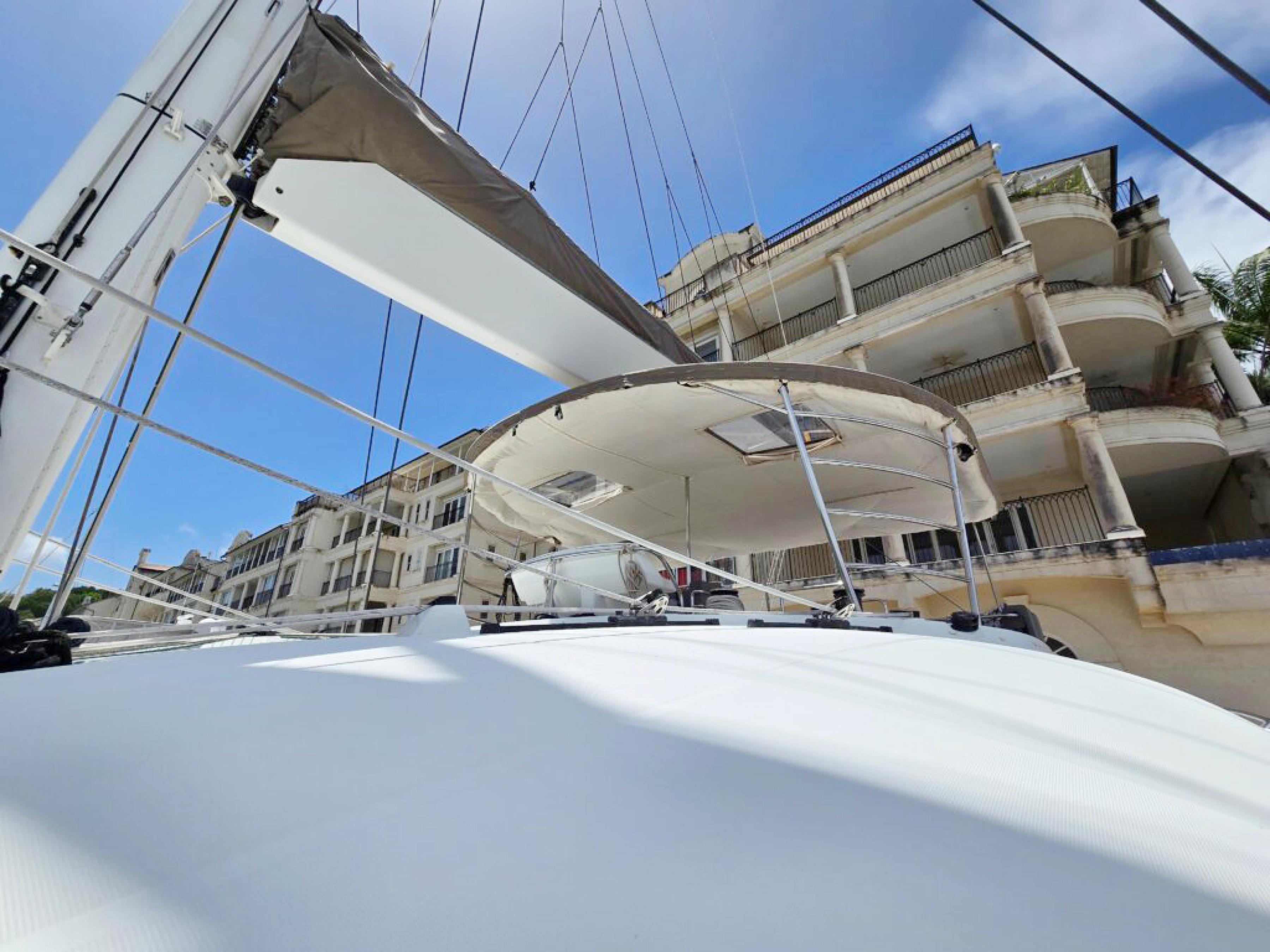 Lagoon-560 S2 2015-Cool Runnings IV SC-US-2015 Lagoon 560 S2 yacht docked near luxury waterfront buildings.-9782915 | Thumbnail