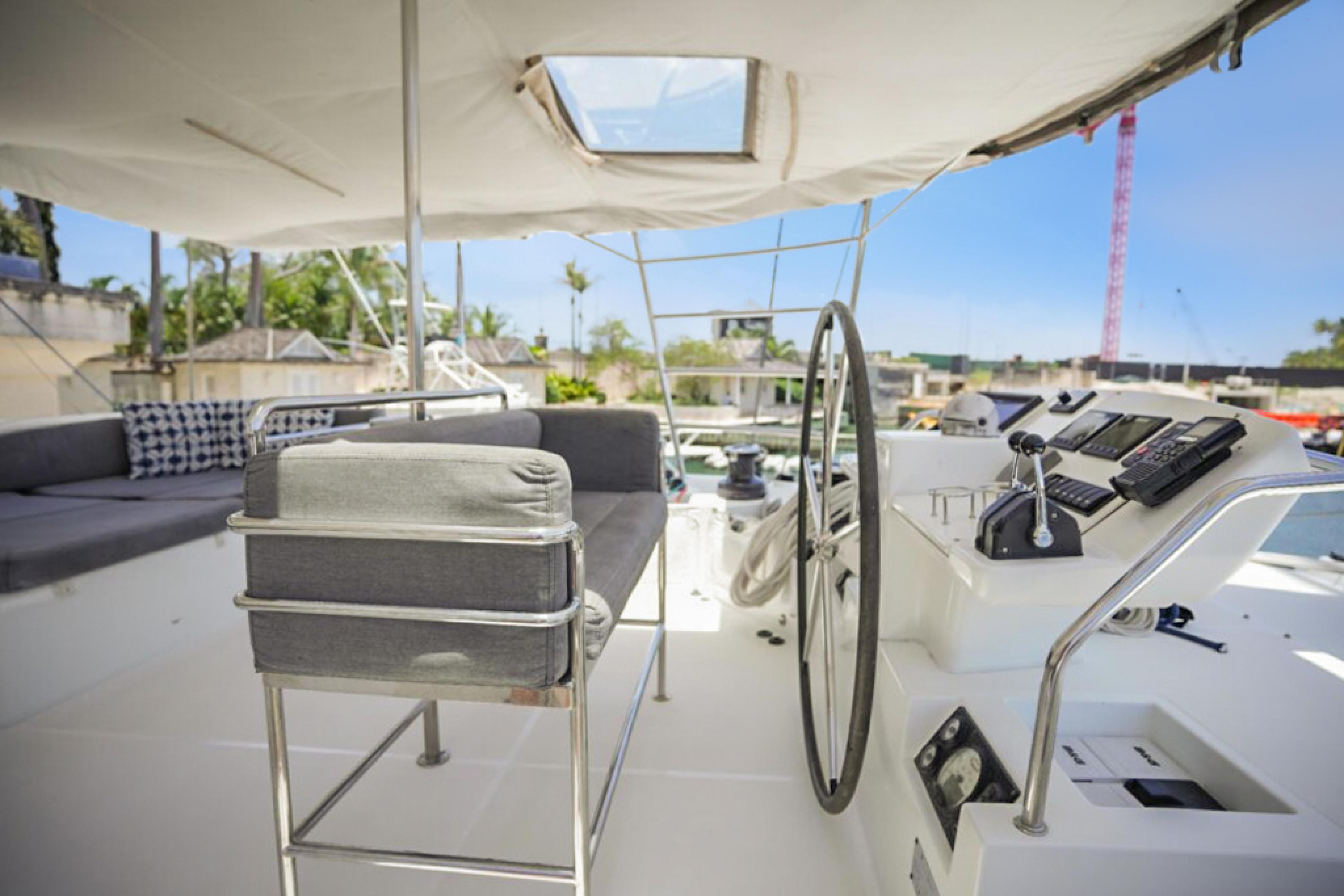 Lagoon-560 S2 2015-Cool Runnings IV SC-US-Helm of 2015 Lagoon 560 S2 yacht with seating and navigation controls.-9782915 | Thumbnail