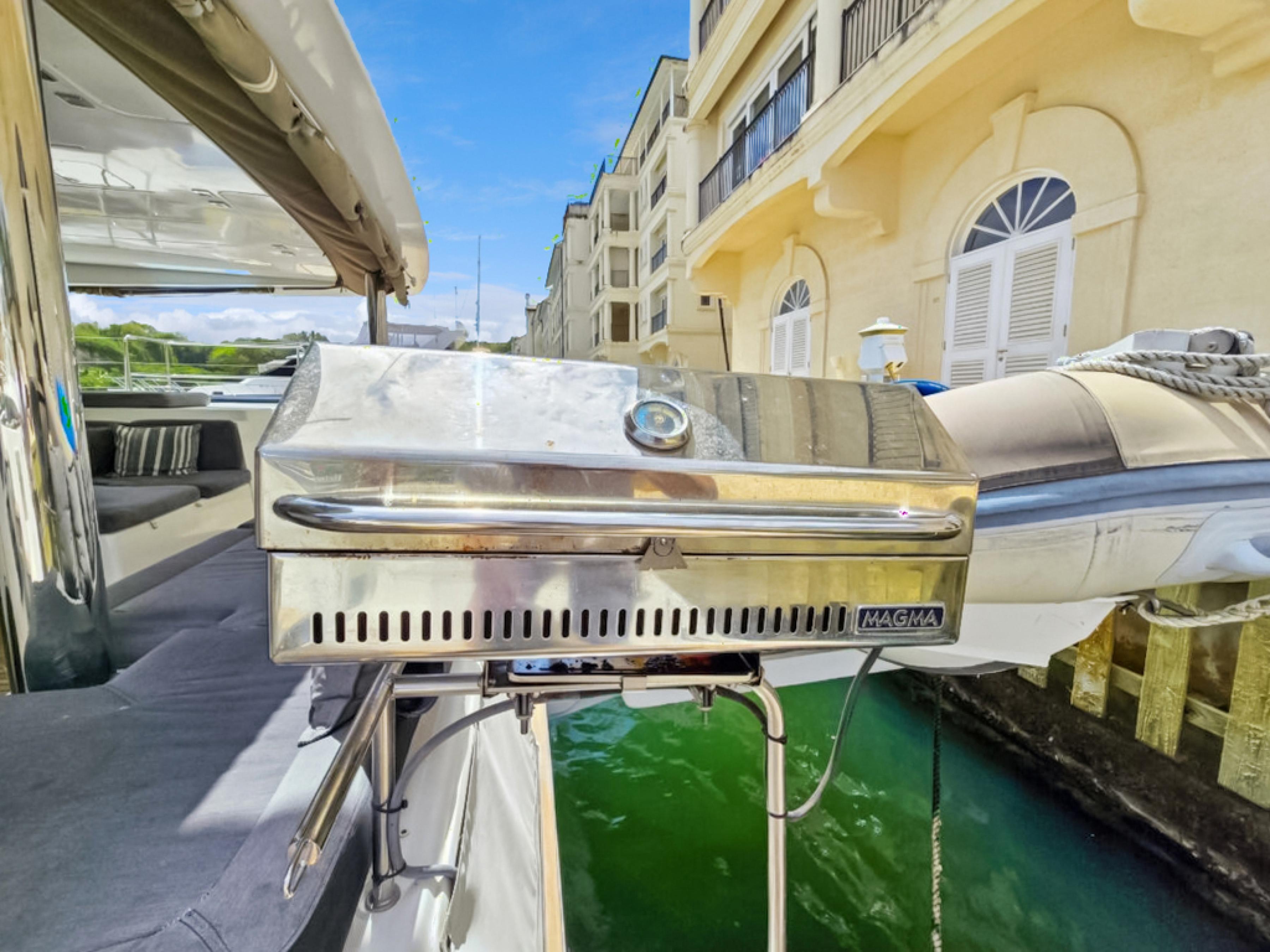 Lagoon-560 S2 2015-Cool Runnings IV SC-US-Outdoor grill on 2015 Lagoon 560 S2 yacht, docked near waterfront buildings.-9782915 | Thumbnail