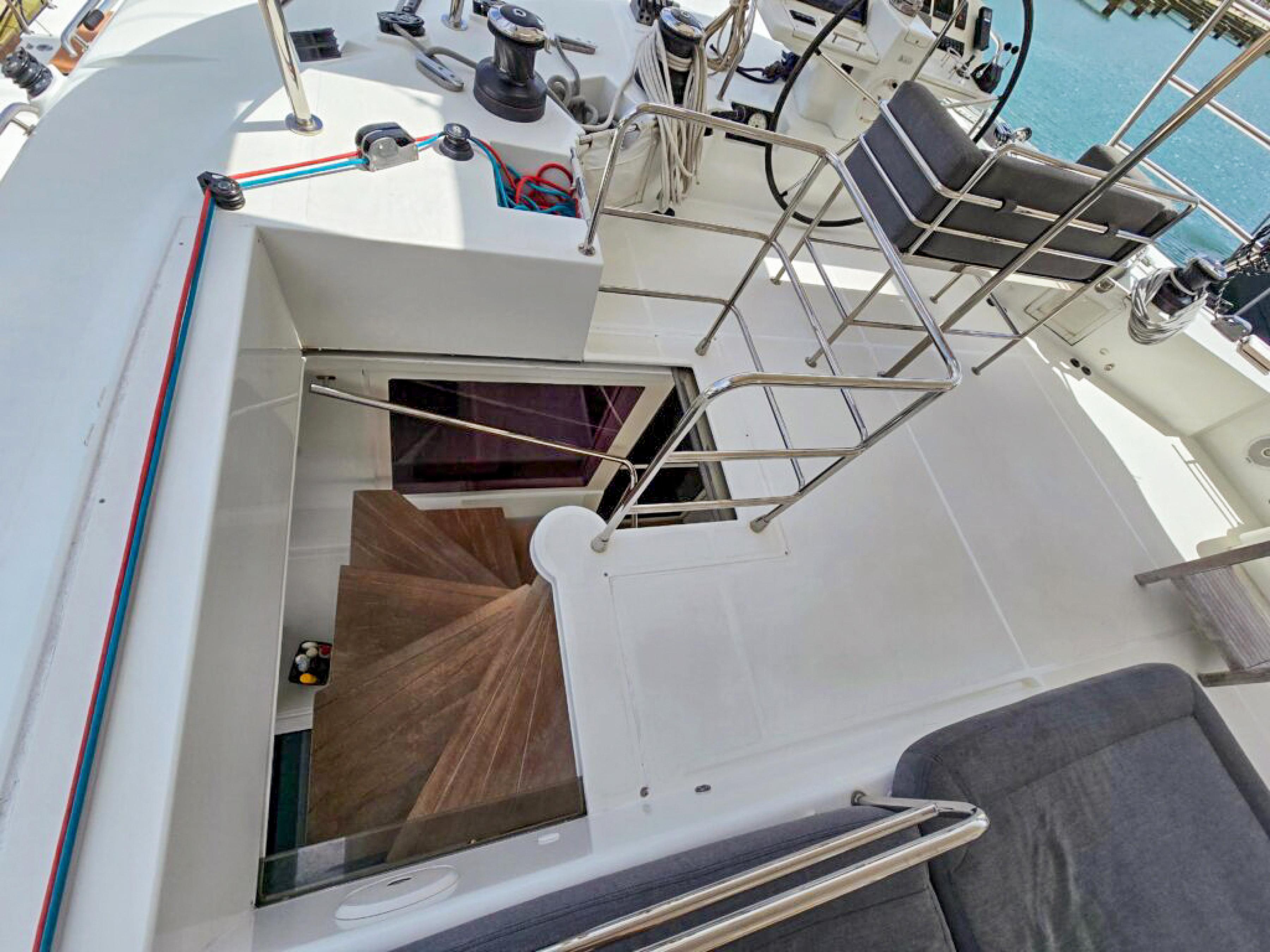 Lagoon-560 S2 2015-Cool Runnings IV SC-US-2015 Lagoon 560 S2 yacht deck with stairs leading below, featuring sleek design and modern amenities.-9782915 | Thumbnail