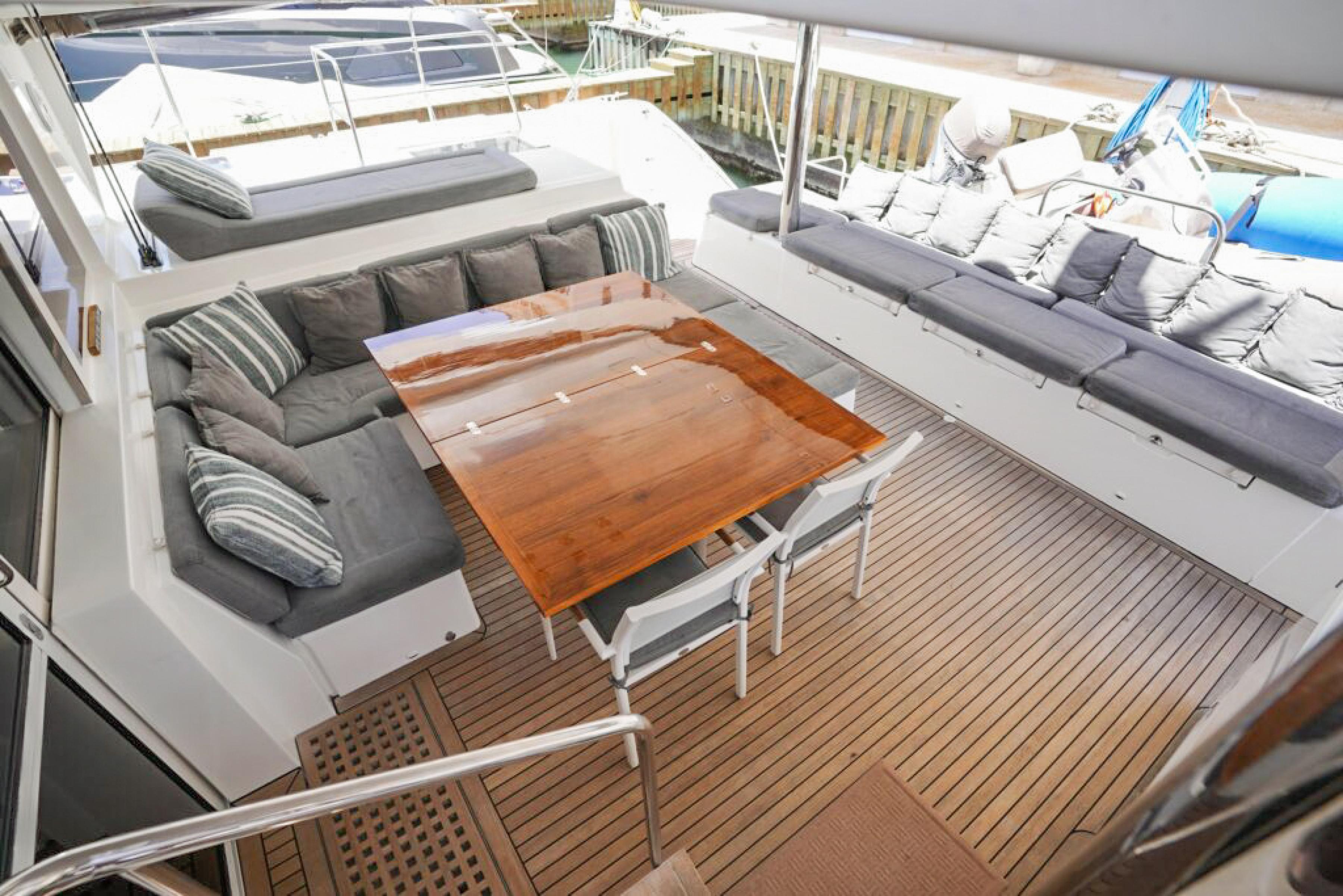 Lagoon-560 S2 2015-Cool Runnings IV SC-US-Spacious deck of 2015 Lagoon 560 S2 yacht with comfortable seating and wooden table.-9782915 | Thumbnail