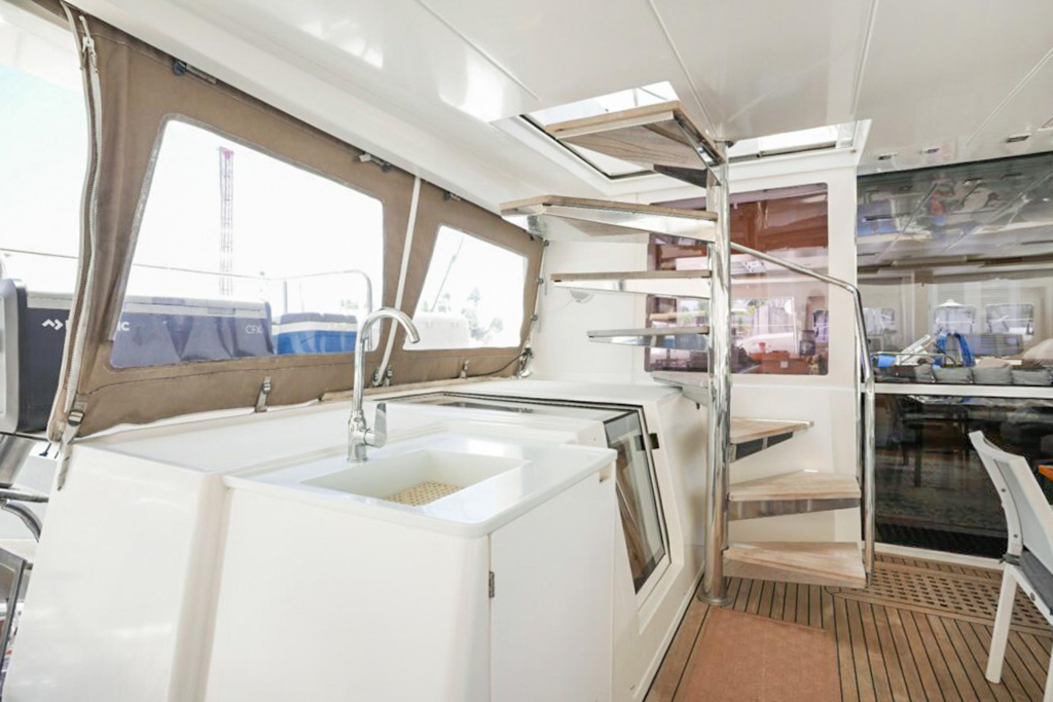 Lagoon-560 S2 2015-Cool Runnings IV SC-US-Interior of 2015 Lagoon 560 S2 yacht with modern kitchen and staircase.-9782915 | Thumbnail