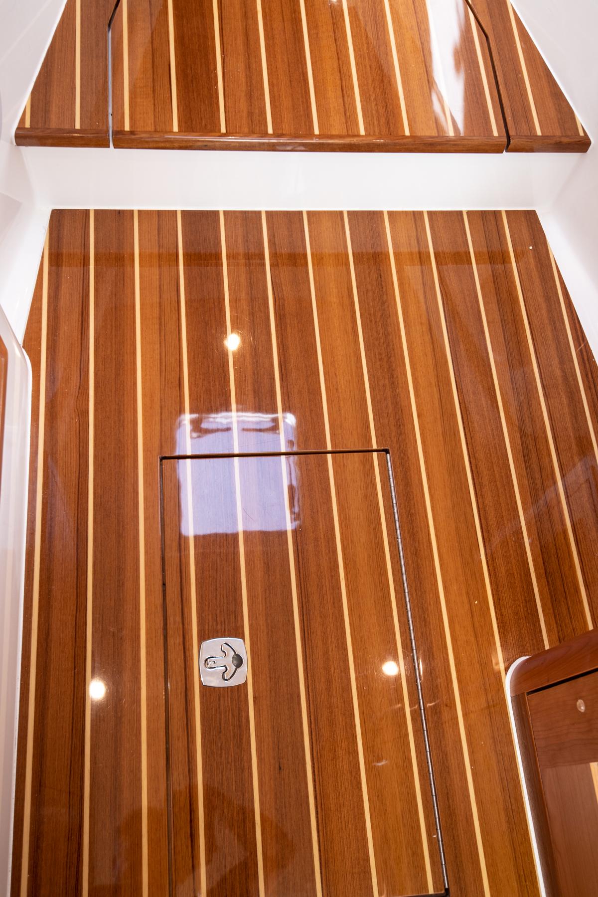 2023 MJM 35 boat interior with polished wooden flooring.