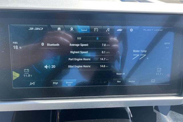 Dashboard of 2021 Yamaha Boats 252XE showing speed, engine hours, and water temperature.