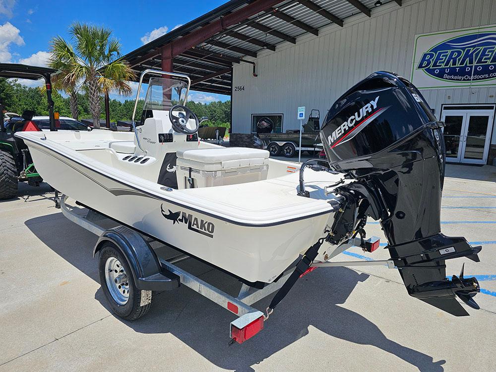 2025 Mako Pro Skiff 15 CC boat with Mercury engine on trailer, outdoors.