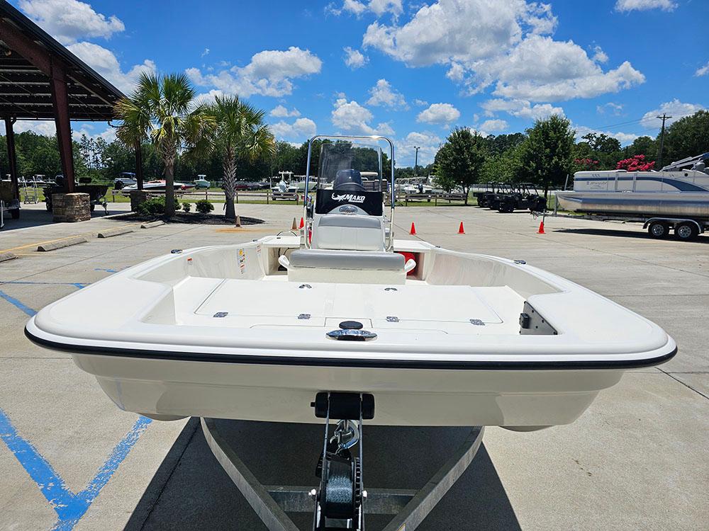 2025 Mako Pro Skiff 15 CC boat on trailer under blue sky.