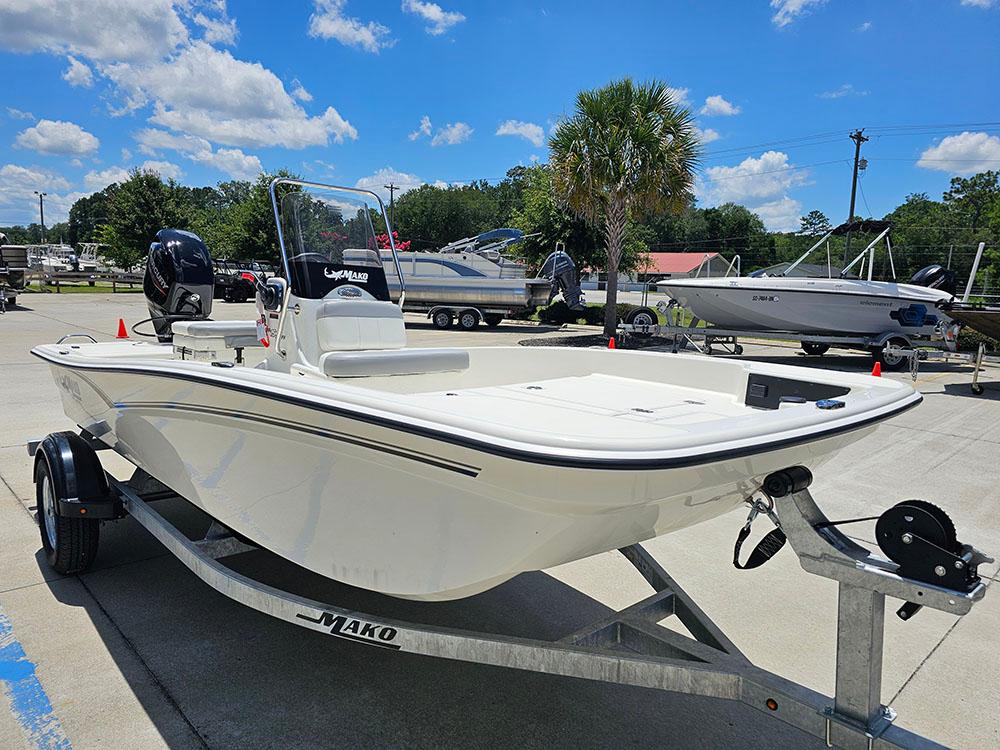 2025 Mako Pro Skiff 15 CC boat on trailer under clear blue sky.