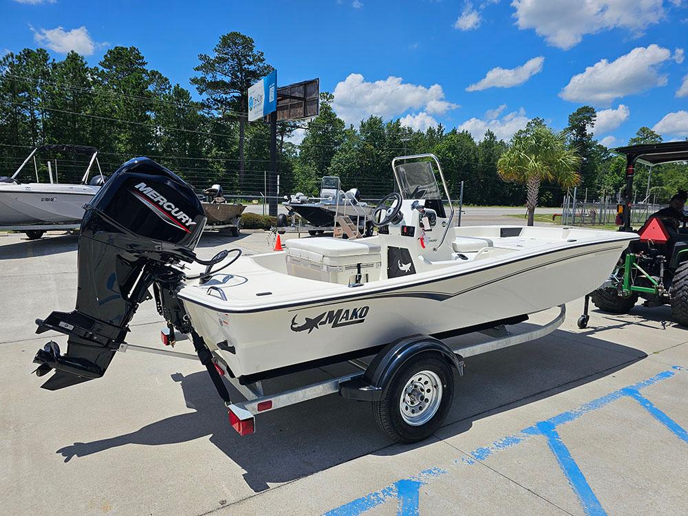 2025 Mako Pro Skiff 15 CC boat with Mercury engine on trailer, outdoors.