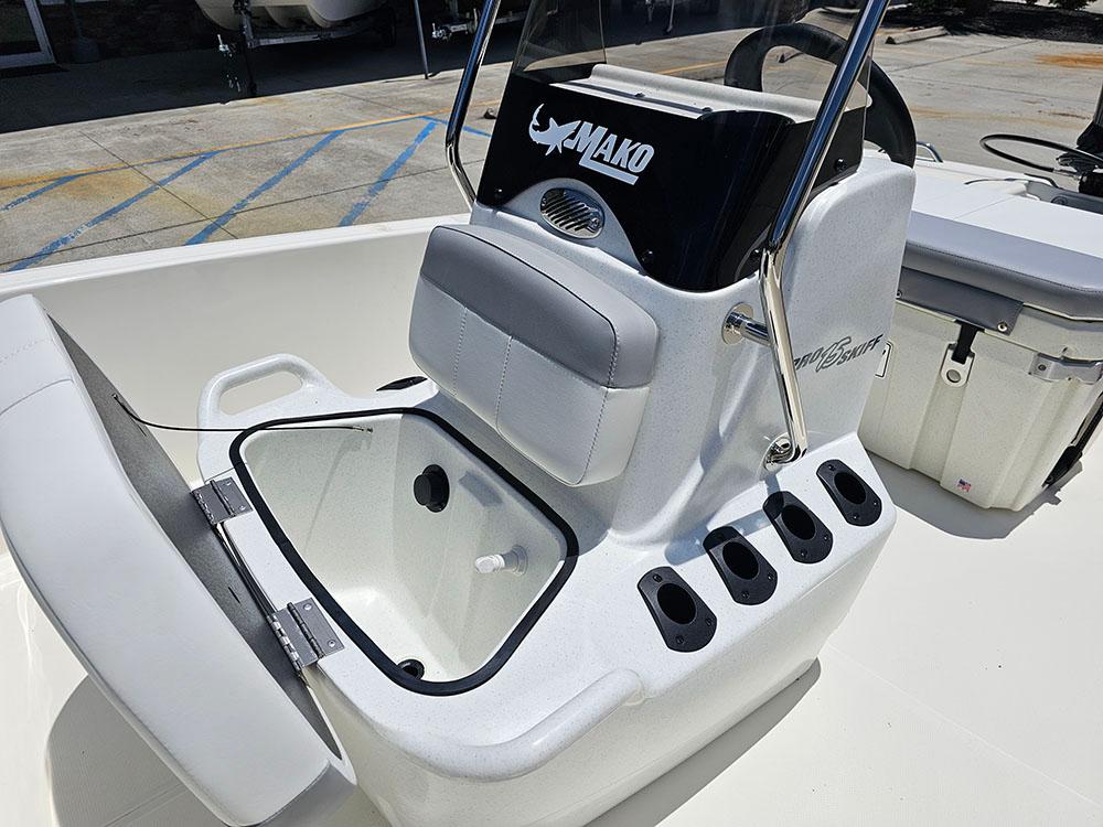 2025 Mako Pro Skiff 15 CC boat interior with storage compartment and rod holders.