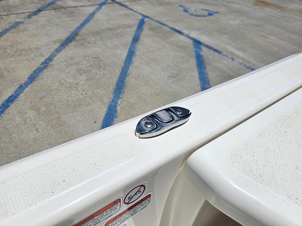 2025 Mako Pro Skiff 15 CC boat detail with cleat on white deck.