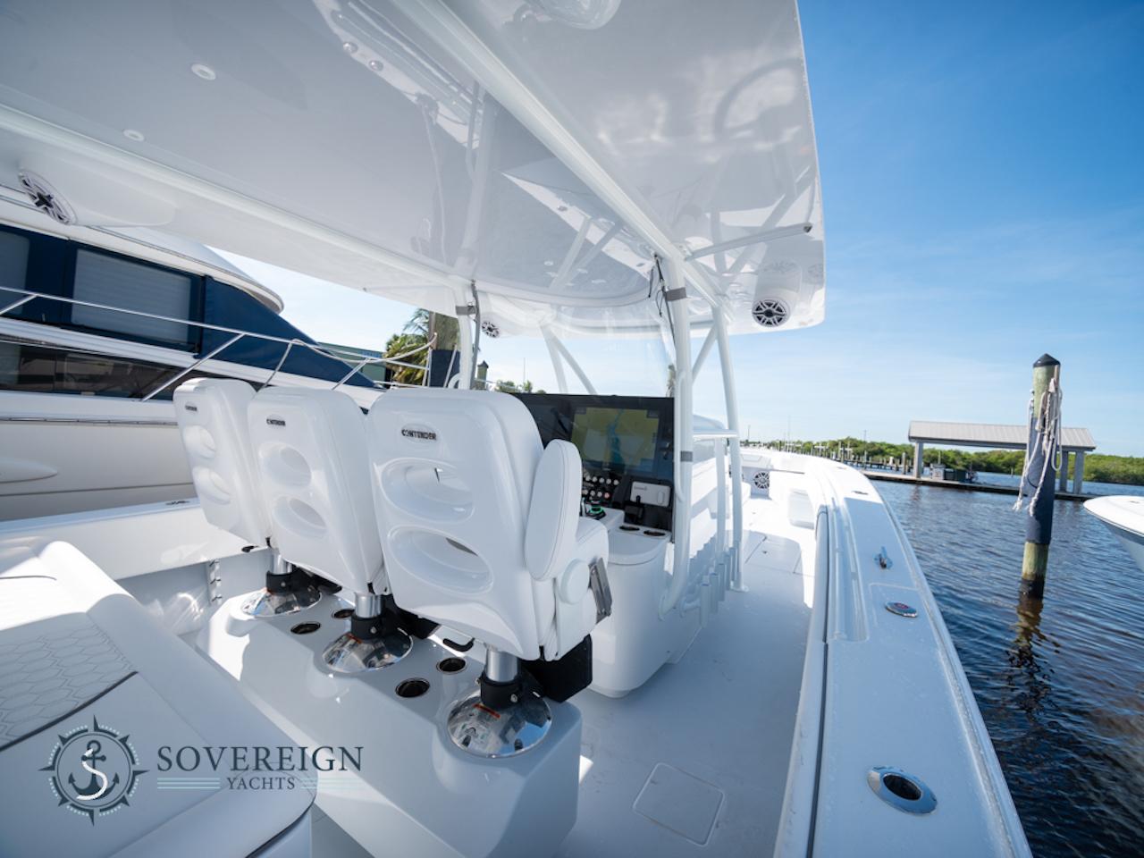 Contender-44 CB 2024-JDJ4C023C324 FL-US-2024 Contender 44 CB yacht interior with helm seats and navigation system.-8992982 | Thumbnail