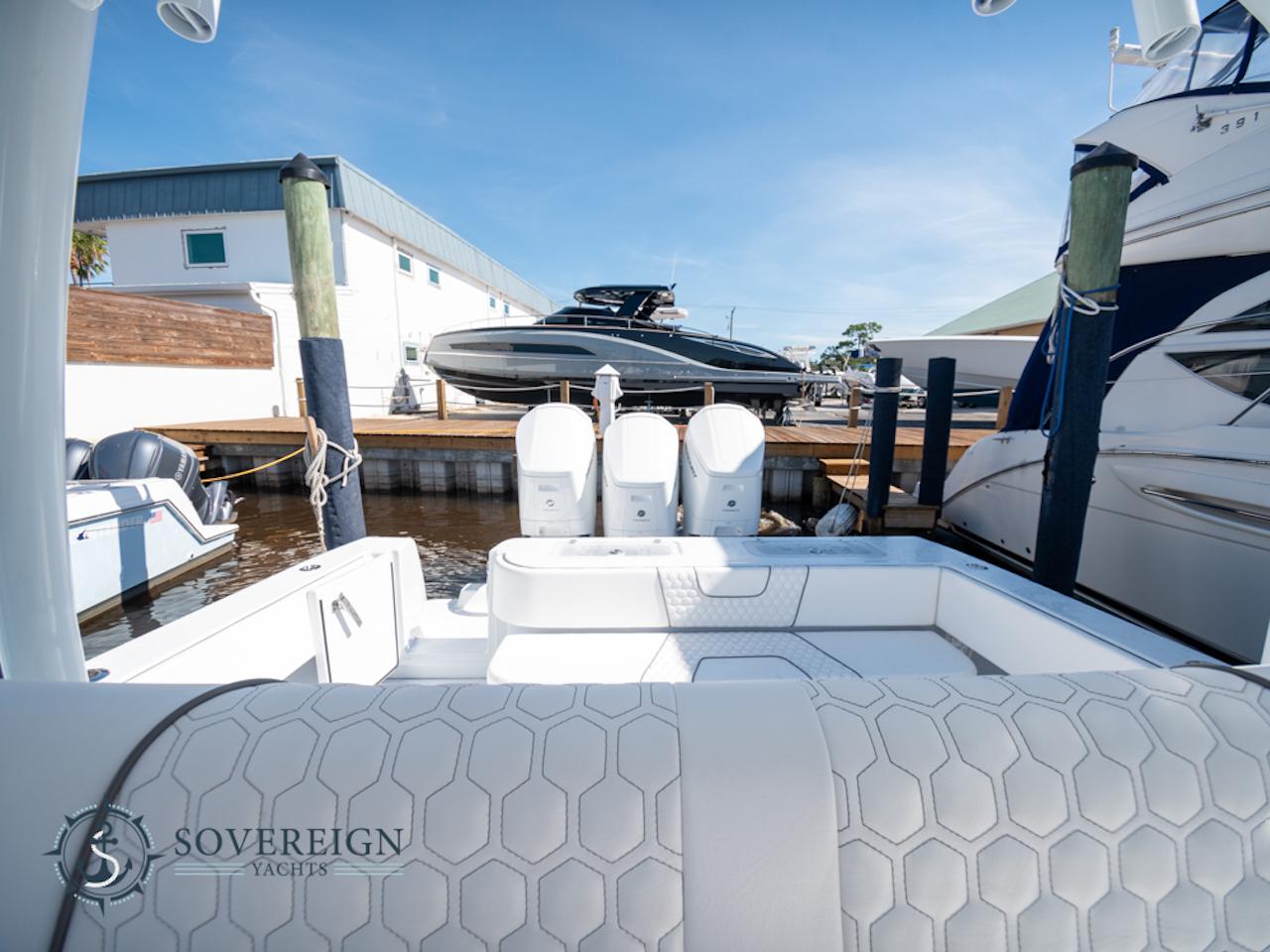 Contender-44 CB 2024-JDJ4C023C324 FL-US-2024 Contender 44 CB boat docked at a marina with triple outboard engines.-8992982 | Thumbnail