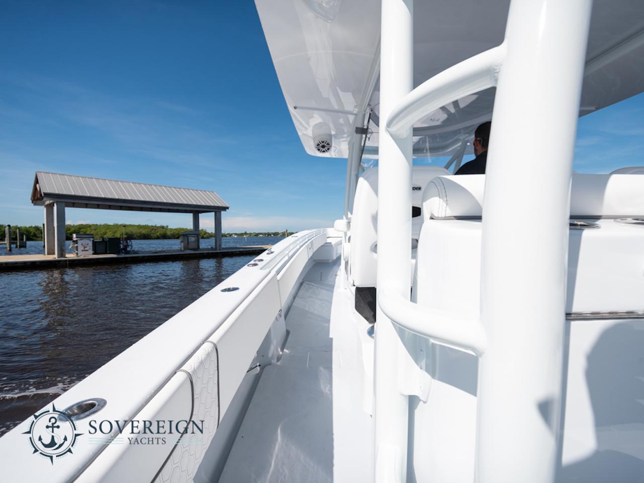 Contender-44 CB 2024-JDJ4C023C324 FL-US-2024 Contender 44 CB yacht docked at a marina, Sovereign Yachts logo visible.-8992982 | Thumbnail