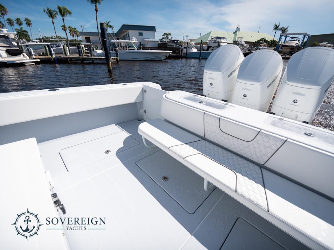 Contender-44 CB 2024-JDJ4C023C324 FL-US-2024 Contender 44 CB boat with triple outboard engines at a marina.-8992982 | Thumbnail