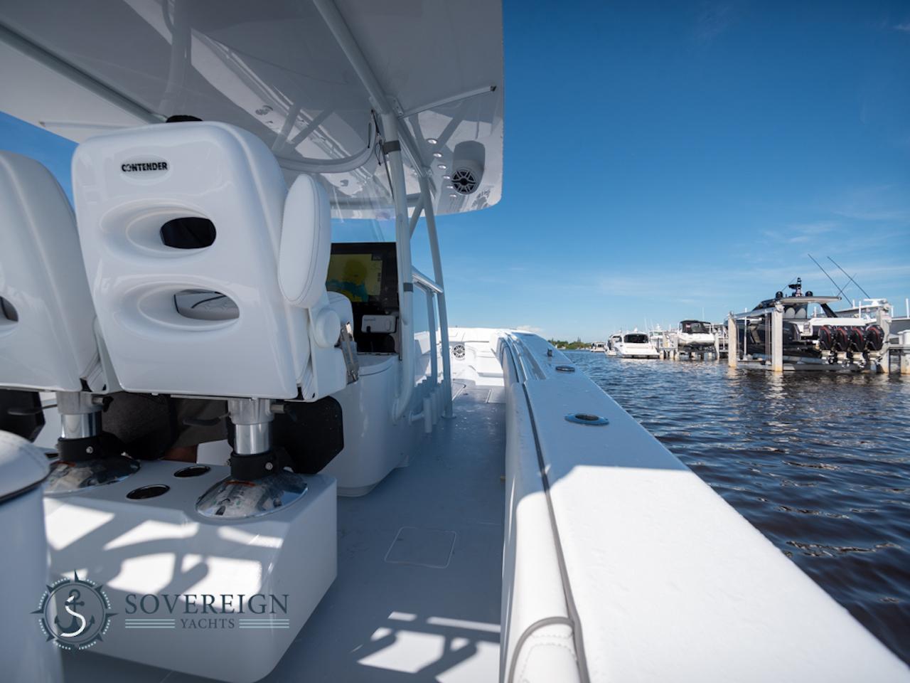 Contender-44 CB 2024-JDJ4C023C324 FL-US-2024 Contender 44 CB yacht interior with white seating, docked at marina.-8992982 | Thumbnail