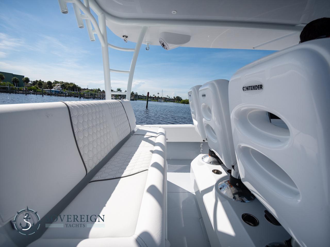 Contender-44 CB 2024-JDJ4C023C324 FL-US-2024 Contender 44 CB boat interior with white seating, Sovereign Yachts logo, and waterfront view.-8992982 | Thumbnail