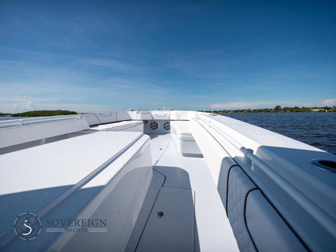 Contender-44 CB 2024-JDJ4C023C324 FL-US-2024 Contender 44 CB boat deck on a sunny day by the water.-8992982 | Thumbnail