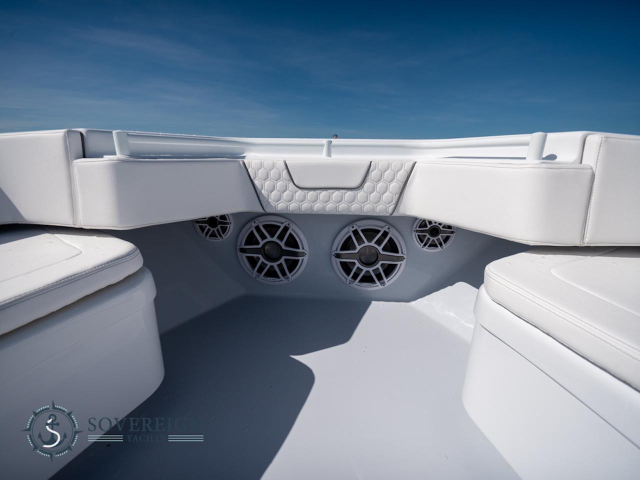 Contender-44 CB 2024-JDJ4C023C324 FL-US-Contender 44 CB 2024 boat interior with white seating and built-in speakers.-8992982 | Thumbnail