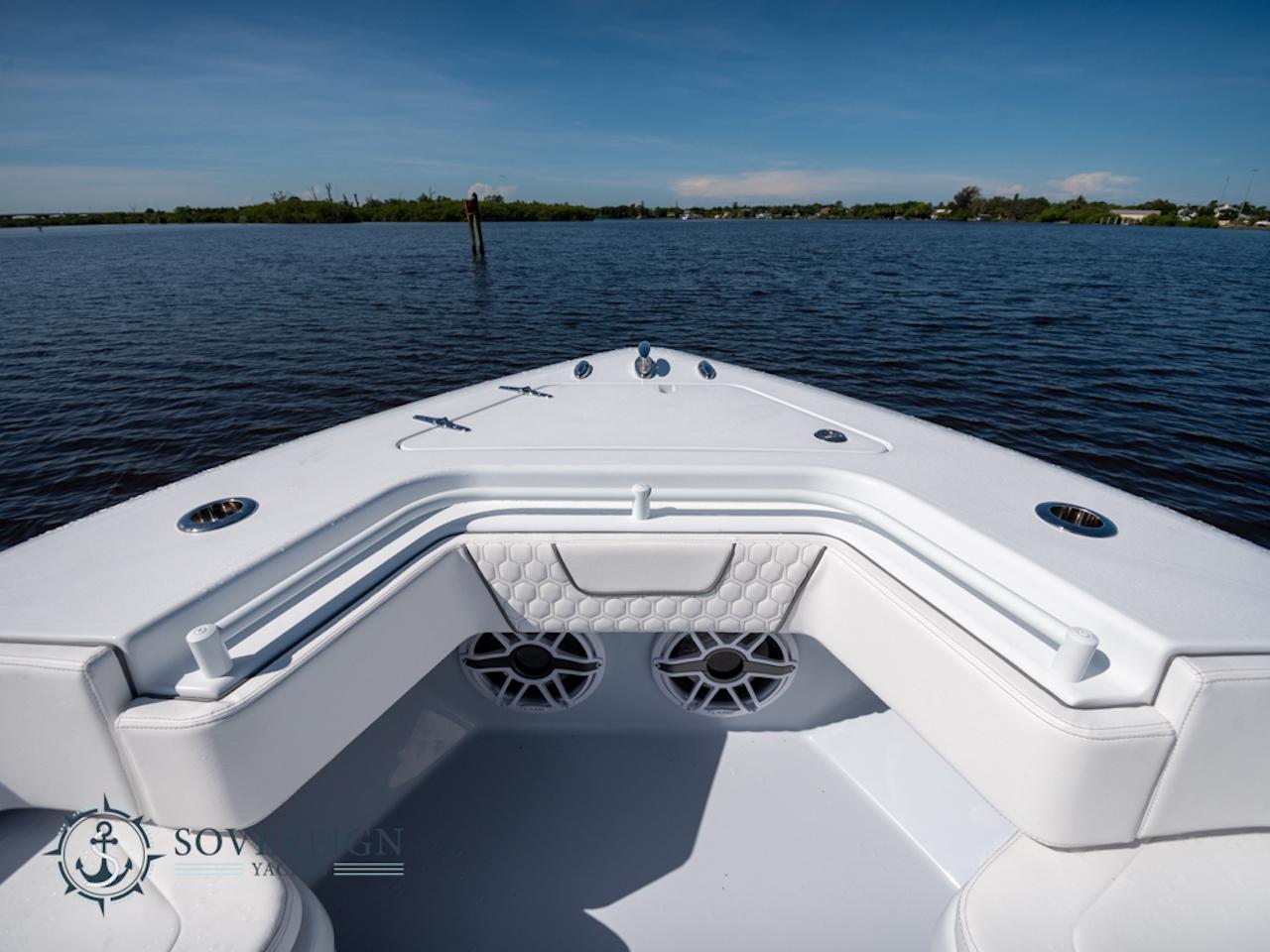 Contender-44 CB 2024-JDJ4C023C324 FL-US-2024 Contender 44 CB boat bow with seating and speakers on a calm lake.-8992982 | Thumbnail