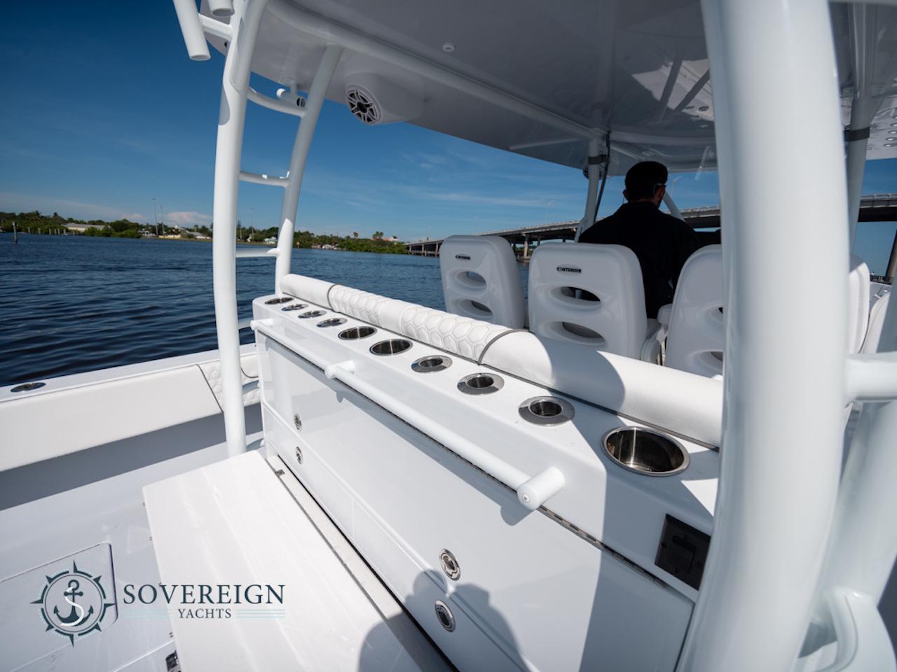 Contender-44 CB 2024-JDJ4C023C324 FL-US-2024 Contender 44 CB yacht interior with rod holders and seating, Sovereign Yachts logo.-8992982 | Thumbnail