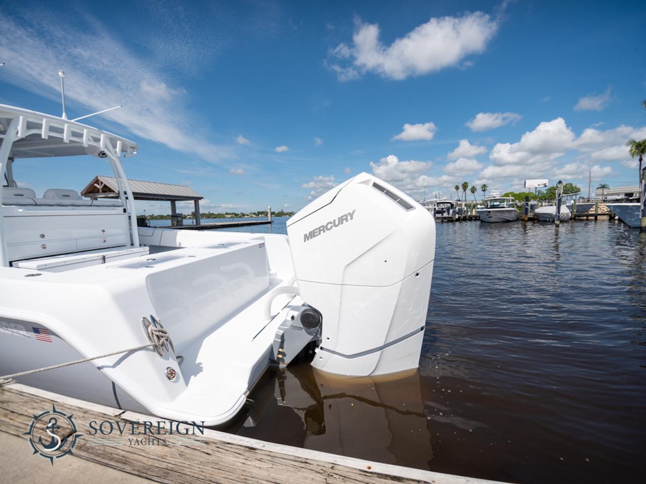 Contender-44 CB 2024-JDJ4C023C324 FL-US-2024 Contender 44 CB boat with Mercury outboard engine docked at marina.-8992982 | Thumbnail