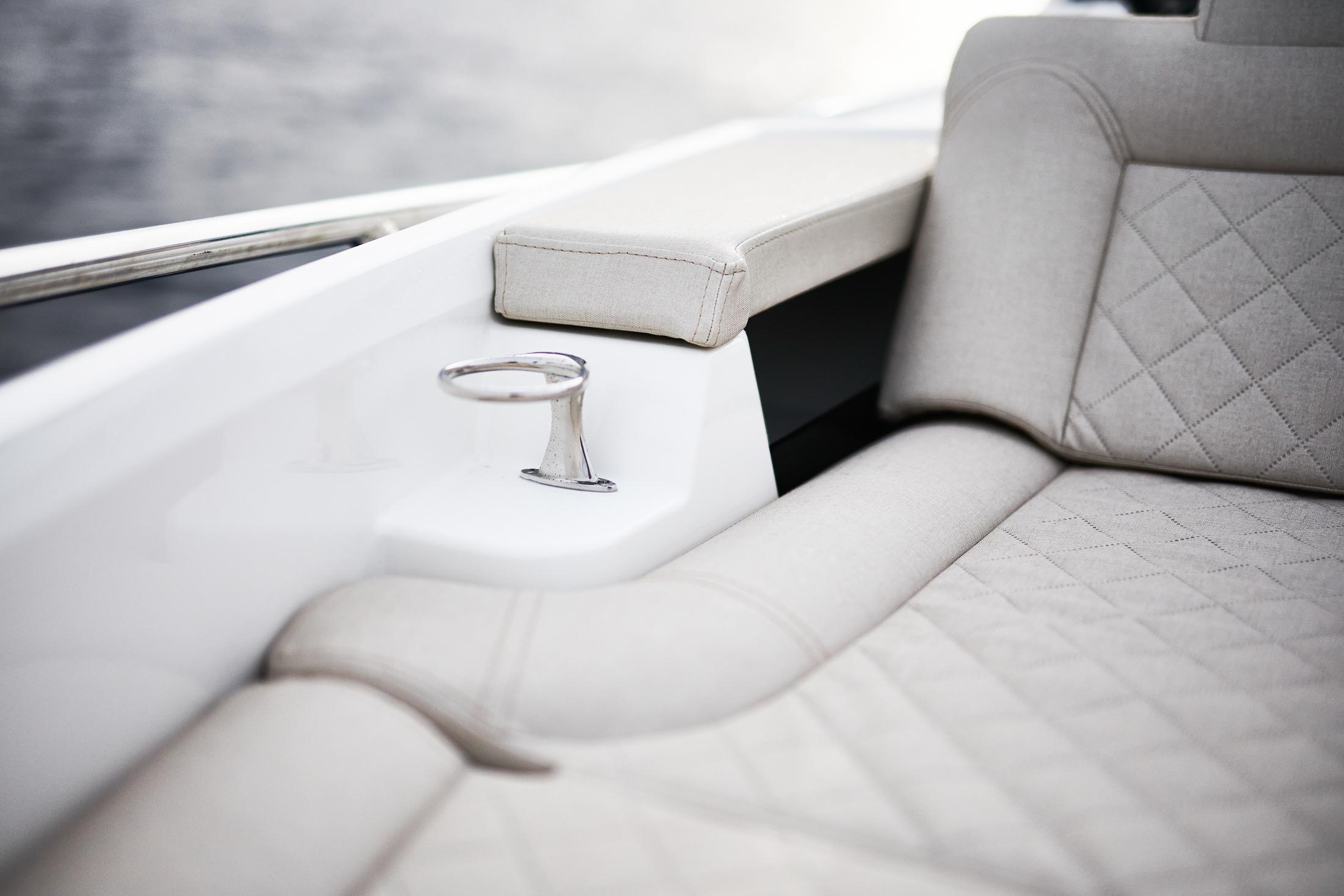 Skamander-Sorrento 2025 -FL-US-Luxurious interior of 2025 Skamander Sorrento boat with elegant seating and cup holder.-9722985 | Thumbnail