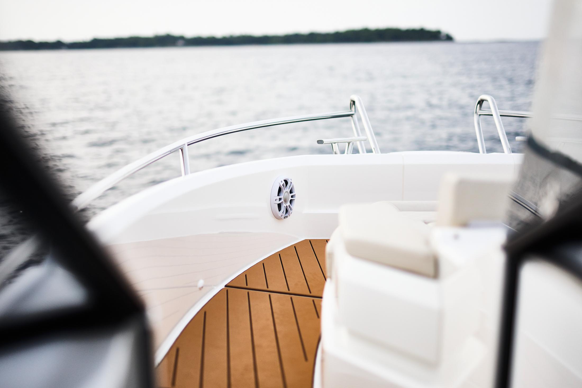 Skamander-Sorrento 2025 -FL-US-2025 Skamander Sorrento boat deck with sleek design and wooden flooring on a calm lake.-9722985 | Thumbnail