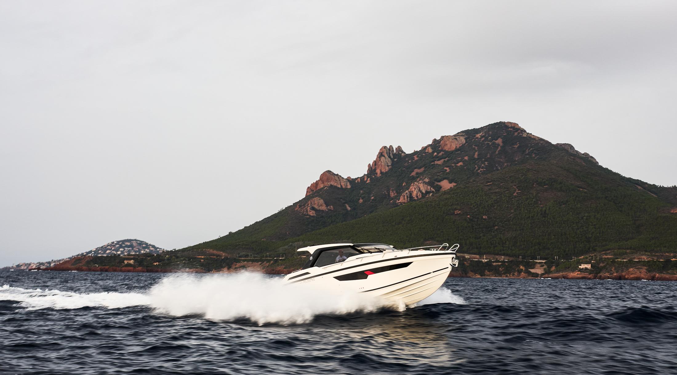 Skamander-Sorrento 2025 -FL-US-2025 Skamander Sorrento boat cruising near a scenic mountainous coastline.-9722985 | Thumbnail