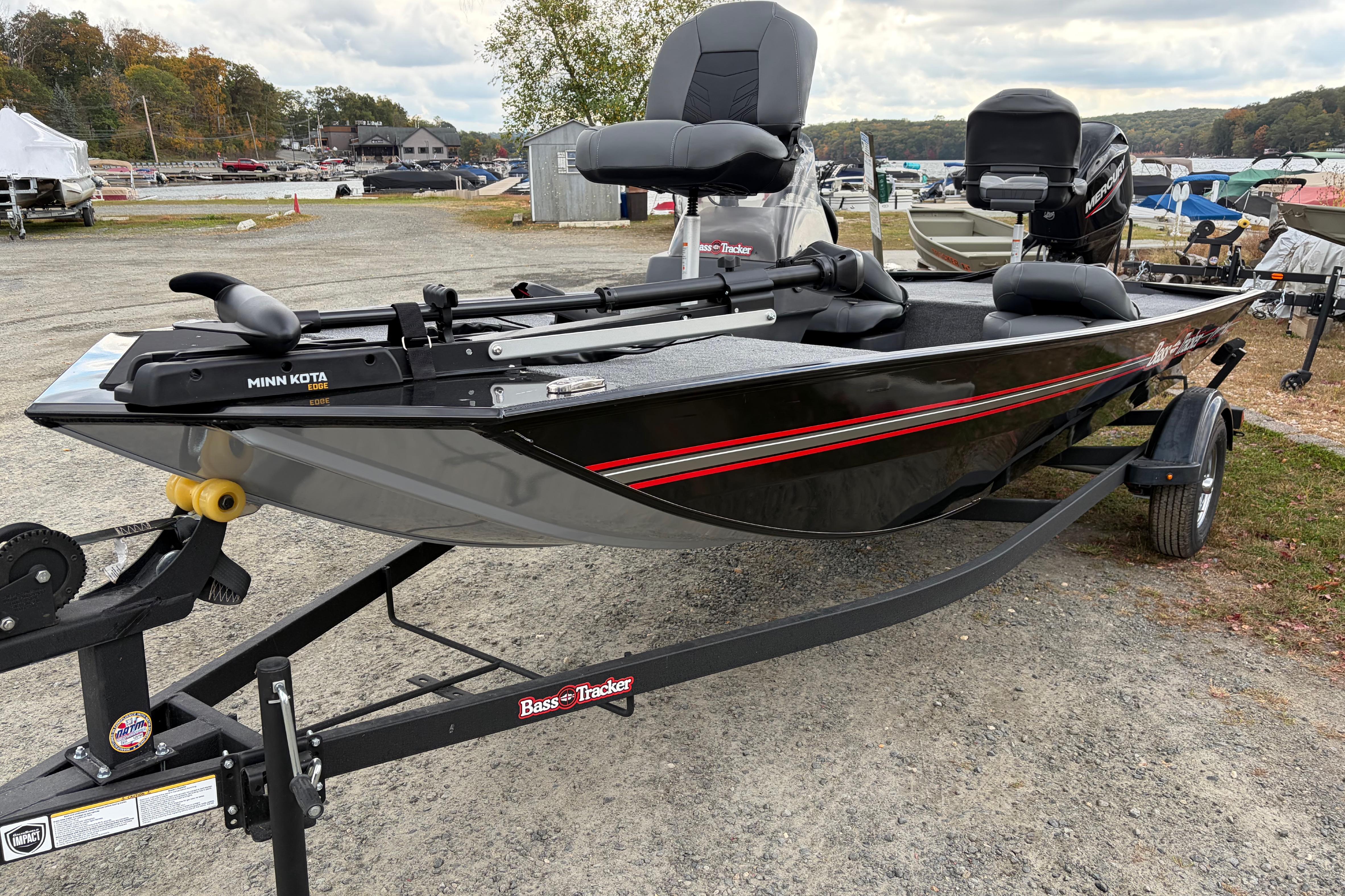 2026 Tracker Bass Tracker Classic XL boat on trailer, parked outdoors.