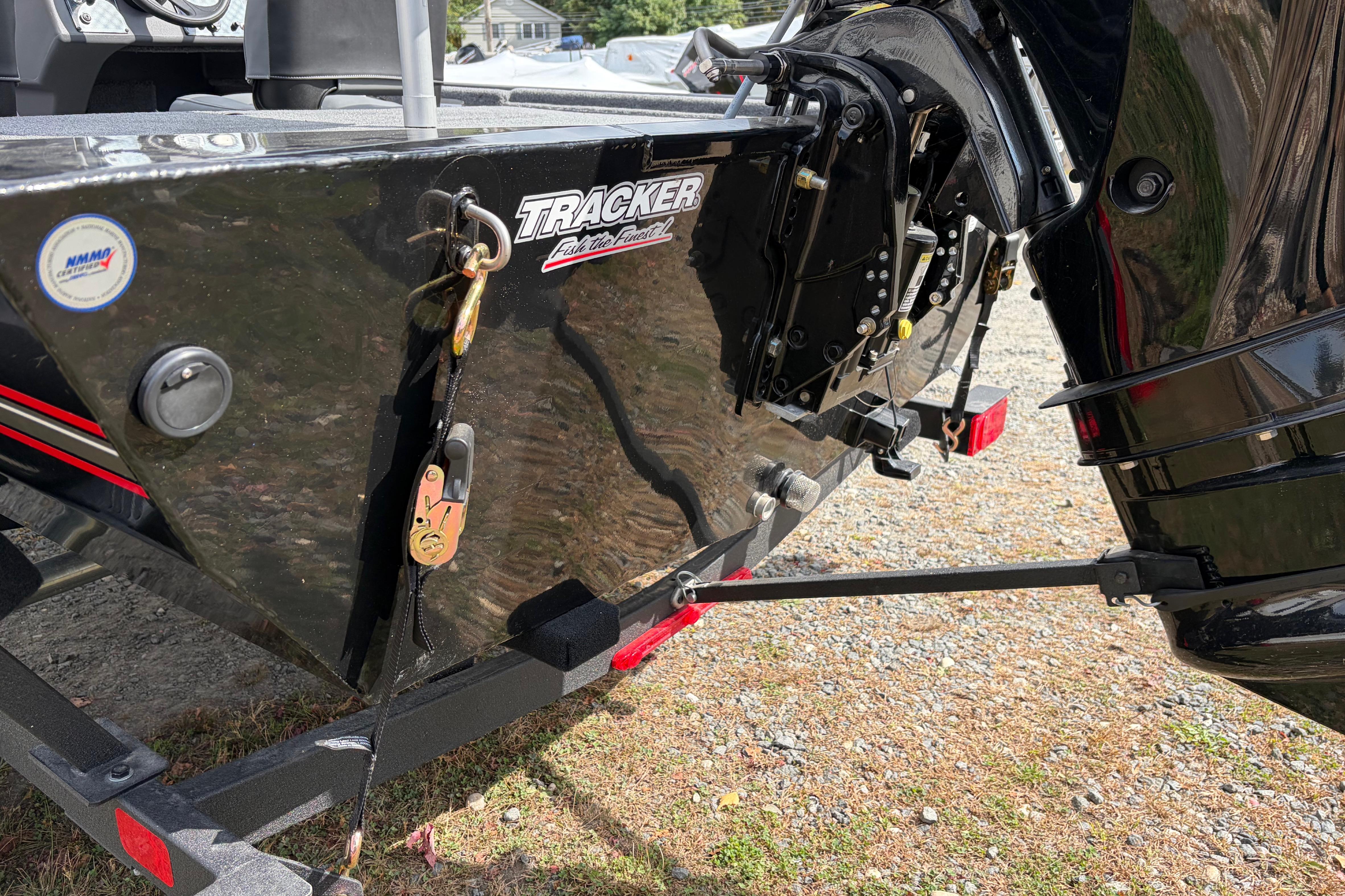 2026 Tracker Bass Tracker Classic XL boat rear view with motor and trailer.