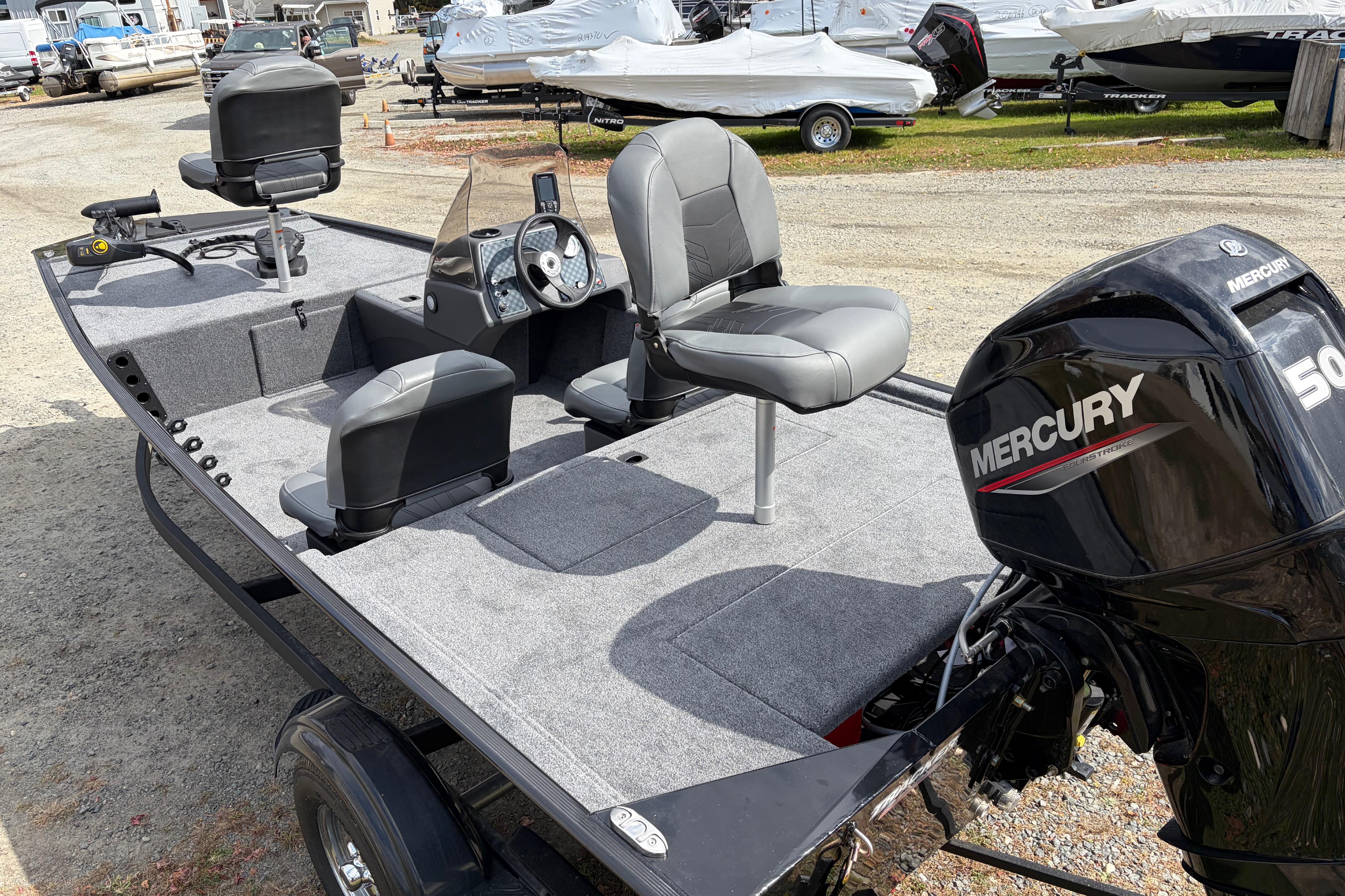 2026 Tracker Bass Tracker Classic XL boat with Mercury engine, featuring comfortable seating and spacious deck.