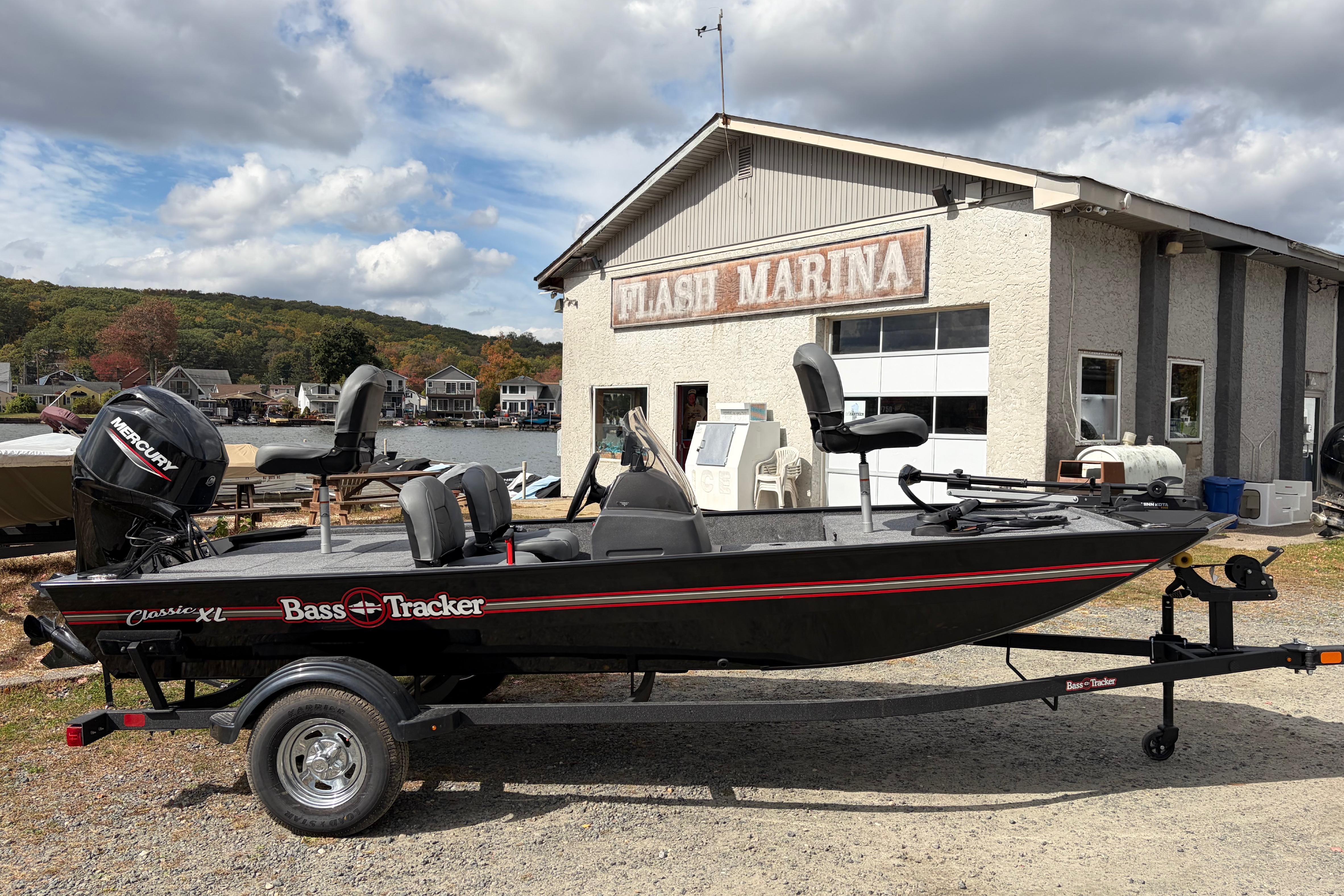 2026 Tracker Bass Tracker Classic XL boat at Flash Marina, under cloudy sky.