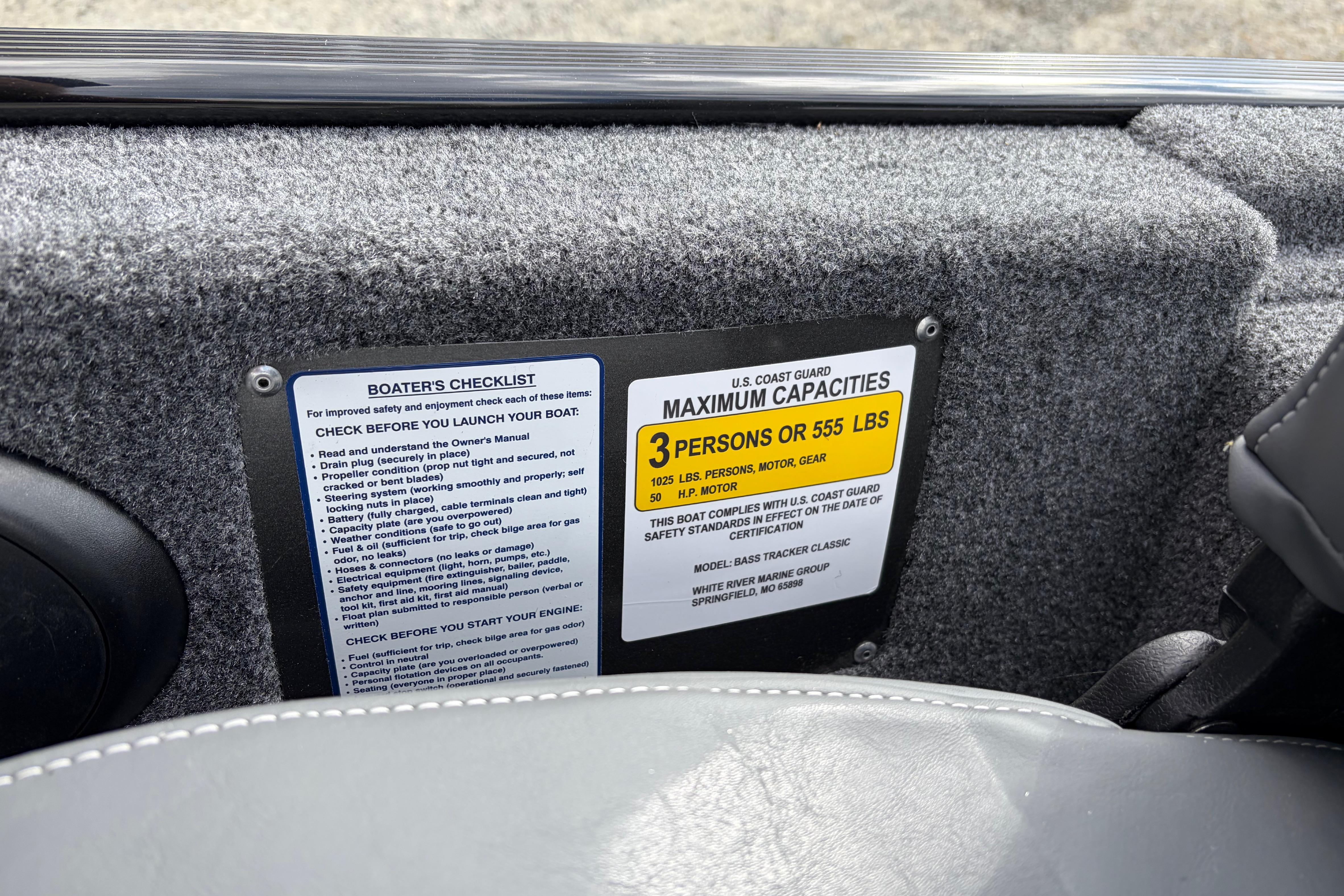 2026 Tracker Bass Tracker Classic XL capacity label and boater's checklist on interior panel.