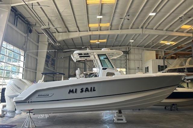 2017 Boston Whaler 280 Outrage boat in a spacious indoor storage facility.