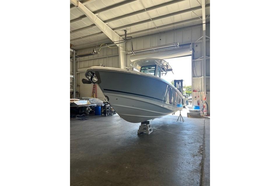 2017 Boston Whaler 280 Outrage boat in a spacious indoor storage facility.
