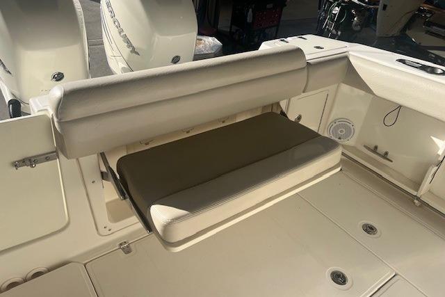 2017 Boston Whaler 280 Outrage boat with foldable rear seating and dual Mercury engines.