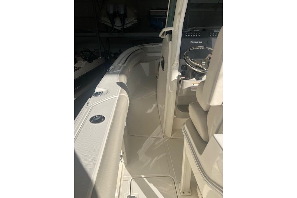 2017 Boston Whaler 280 Outrage boat interior with steering console and seating.