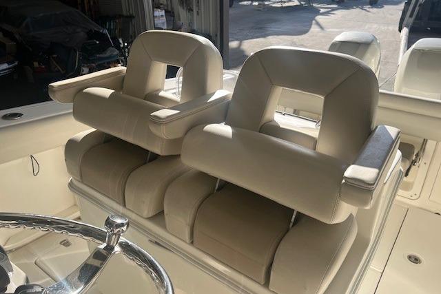 2017 Boston Whaler 280 Outrage boat seats, beige upholstery, dual helm chairs.