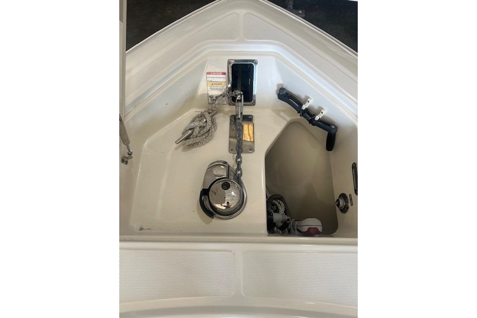 Anchor compartment of 2017 Boston Whaler 280 Outrage boat, featuring chain and rope storage.