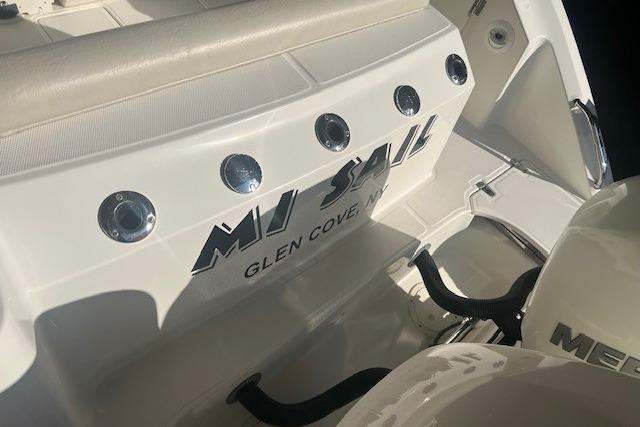 2017 Boston Whaler 280 Outrage boat with "MJ SAIL" and "Glen Cove, NY" text.