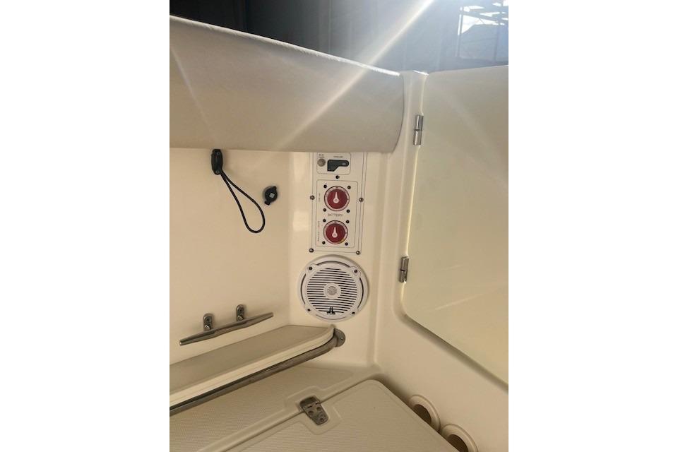 Interior view of a 2017 Boston Whaler 280 Outrage boat, featuring control panel and speaker.