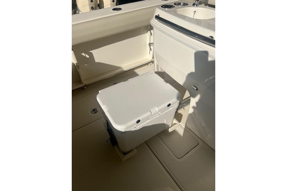 2017 Boston Whaler 280 Outrage interior with cooler and sink area.